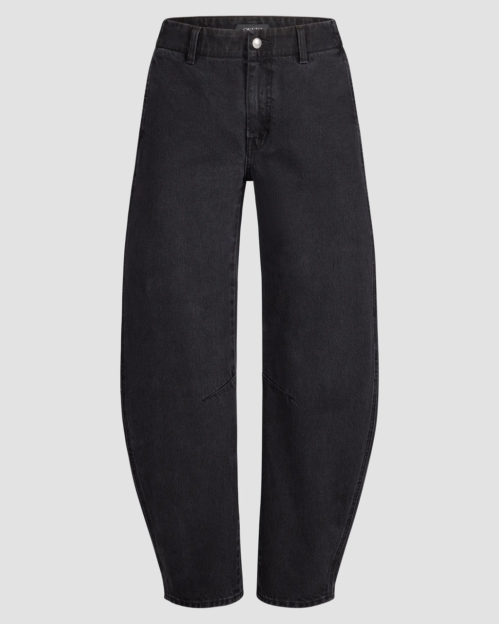 Mid-waisted barrel-leg jean in deep black denim, knee seams visible; front button and zipper closure, shown on light gray backdrop. Pleated hem detail at cuff adds volume.