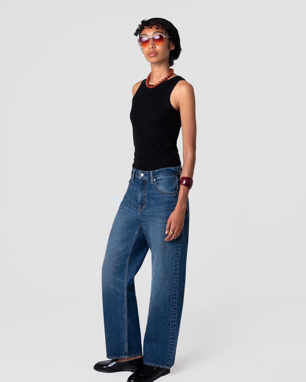 Oketo Cut 101 Straight Jean in Vintage Dark indigo, mid-rise, straight leg drape; subtle fading at seams. Front view on model.