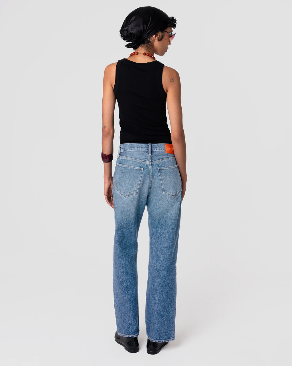 Rear view of Oketo Cut 101 Straight Jean in Vintage Light; mid-rise, straight leg, soft faded indigo denim with subtle whiskering.