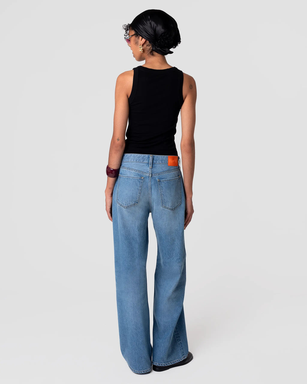Rear view of Cut 102 Tailored Jean in Vintage Light; straight leg, refined drape, pale indigo wash with gentle fading at seams.