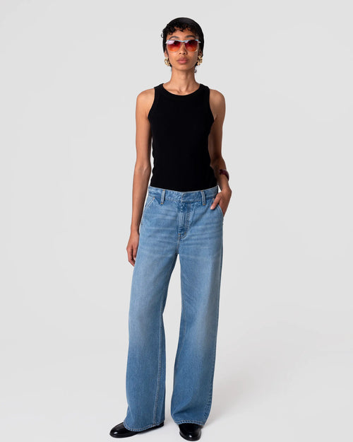 Oketo Cut 102 Tailored Jean in Vintage Light: mid-rise, tapered leg, subtle fading, structured drape; front view highlights pocket detail.