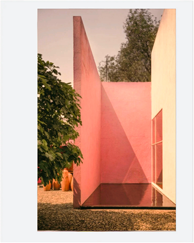 No denim garment is visible; scene features pink stucco walls, shallow pool reflections, greenery, and soft outdoor lighting.